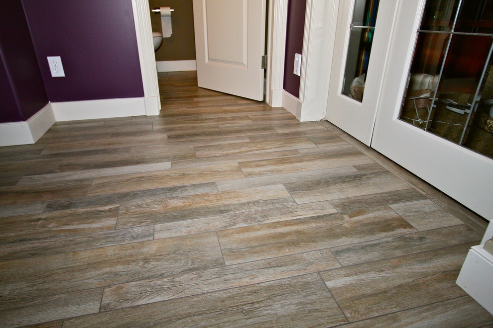 Design ideas for a transitional hallway in Calgary with purple walls and ceramic floors.