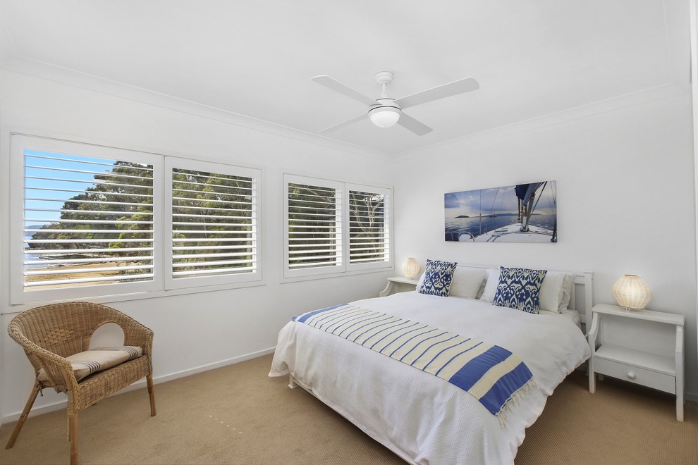 This is an example of a beach style bedroom in Sydney.
