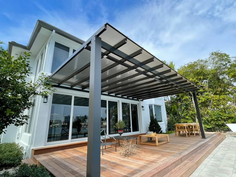 Design ideas for a mid-sized modern backyard patio in Miami with a pergola.