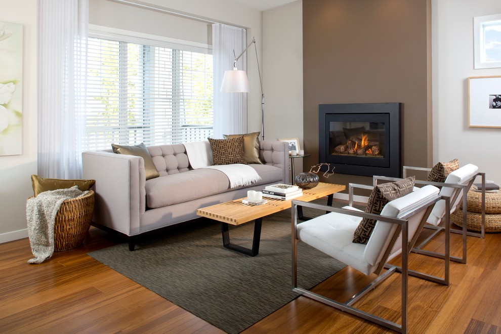 Inspiration for a mid-sized modern living room in Calgary with a standard fireplace.