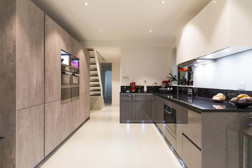 Photo of a contemporary open plan kitchen in London.