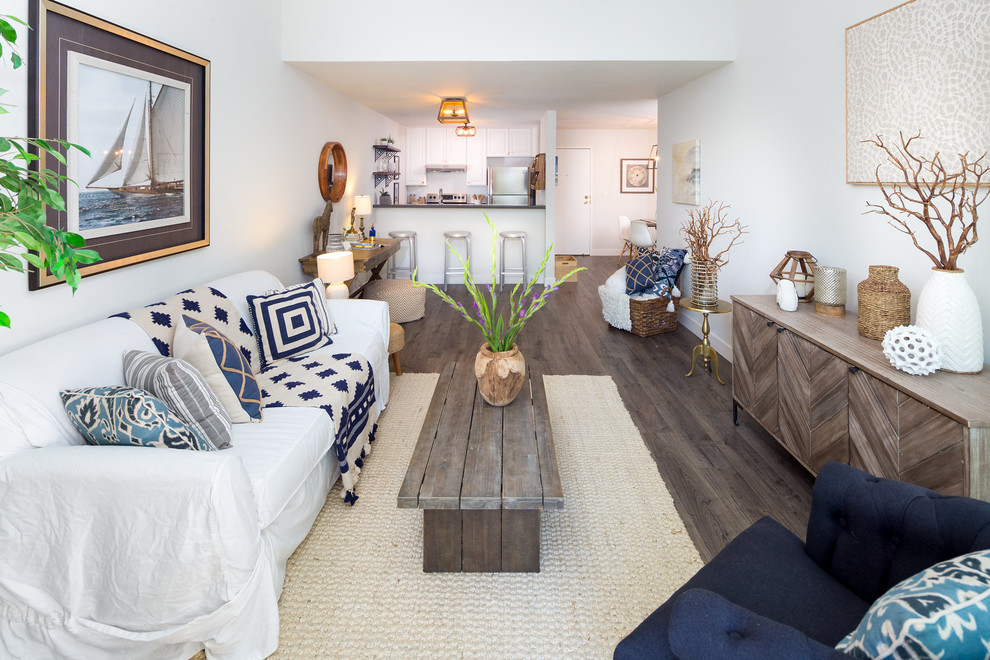 Design ideas for a small beach style open concept living room in San Francisco with white walls and laminate floors.