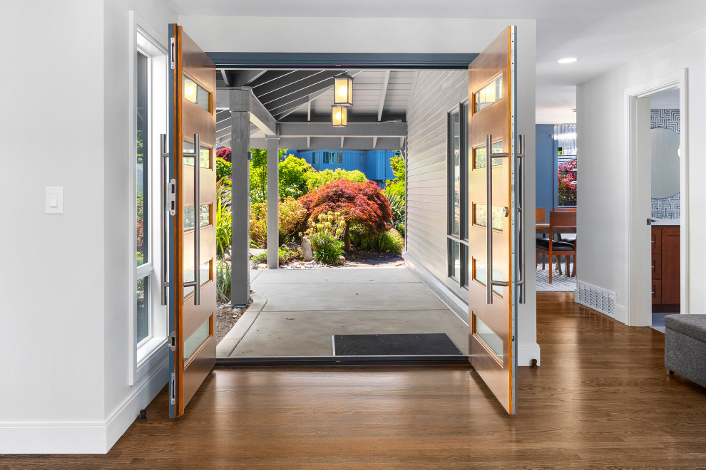 Entryway - mid-century modern medium tone wood floor entryway idea in Seattle