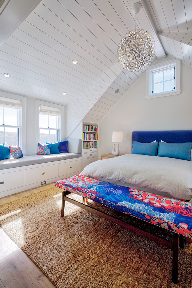 Design ideas for a beach style bedroom in Other with beige walls, light hardwood floors and beige floor.