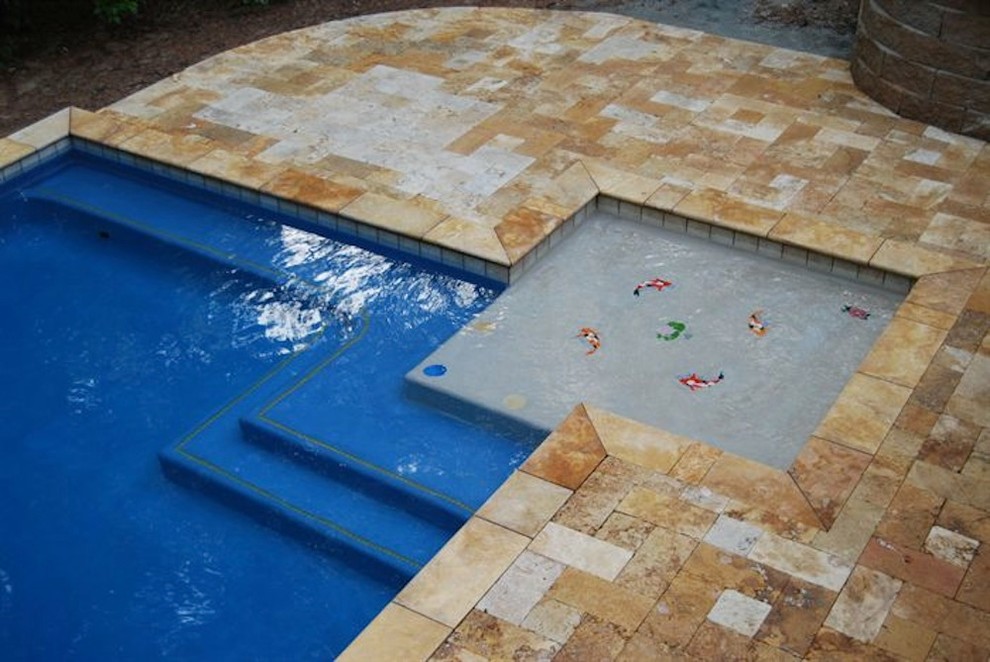Pool - mid-sized backyard stone and rectangular pool idea