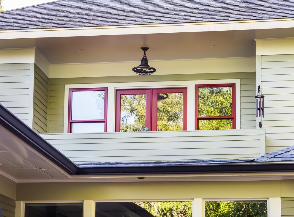 This is an example of a craftsman back porch design in Atlanta with a roof extension.