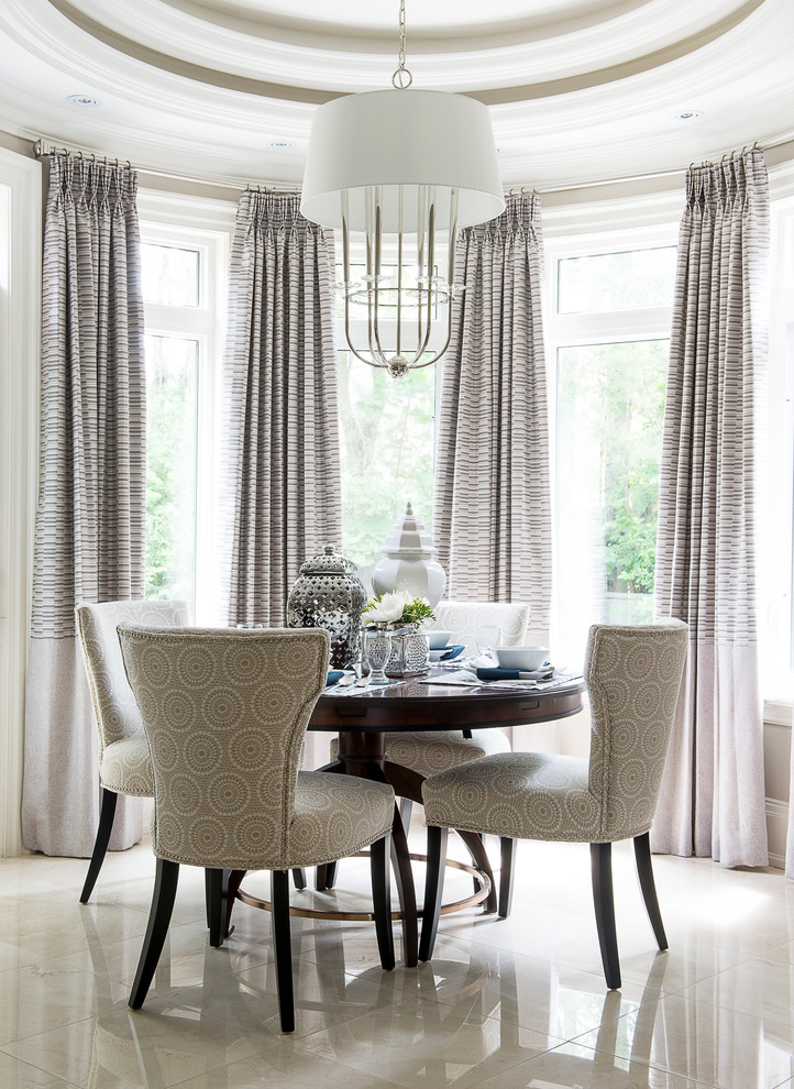 Inspiration for a traditional dining room in Toronto with beige walls.