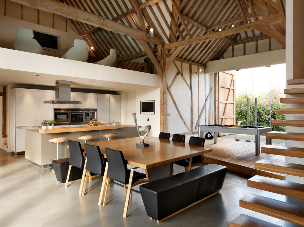 Design ideas for a contemporary kitchen/dining combo in Cheshire with white walls.