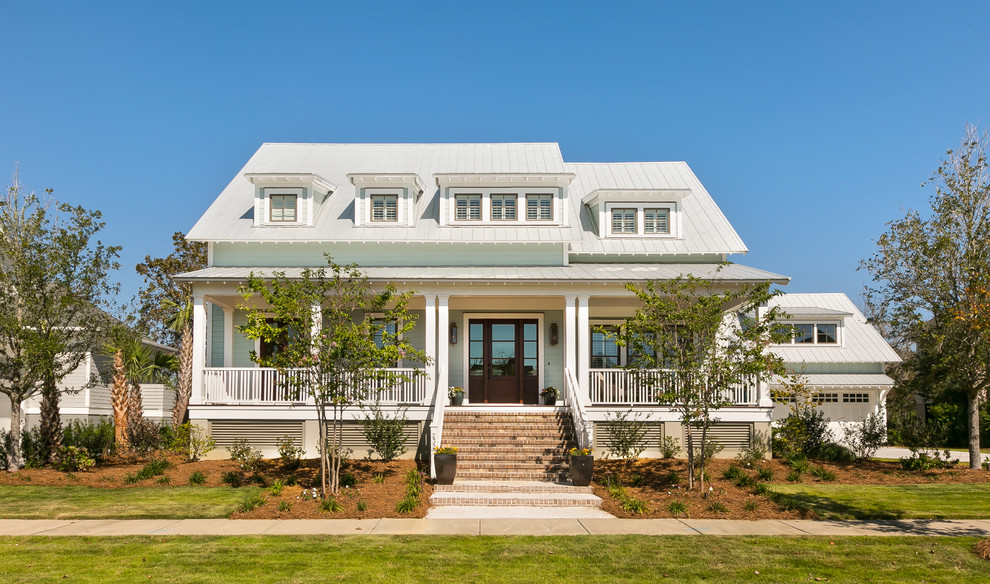 Mid-sized beach style two-storey exterior in Charleston with concrete fiberboard siding.