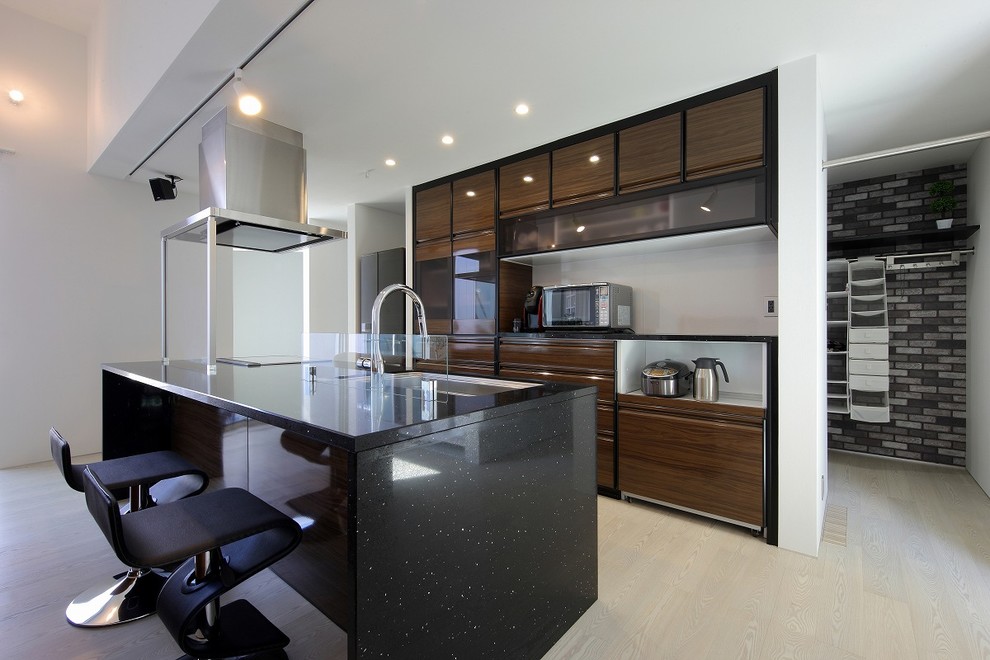 Photo of a modern single-wall eat-in kitchen in Other with an undermount sink, beaded inset cabinets, brown cabinets, solid surface benchtops, window splashback, stainless steel appliances, plywood floors, with island, white floor and black benchtop.