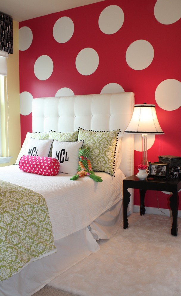 This is an example of a contemporary kids' bedroom for kids 4-10 years old and girls in Charlotte with carpet and multi-coloured walls.
