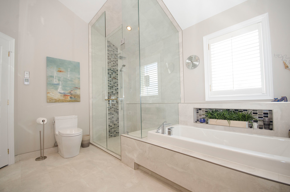 Inspiration for a mid-sized contemporary master bathroom in Toronto with flat-panel cabinets, dark wood cabinets, a drop-in tub, an alcove shower, beige tile, porcelain tile, beige walls, porcelain floors, an undermount sink, granite benchtops, beige floor and a hinged shower door.