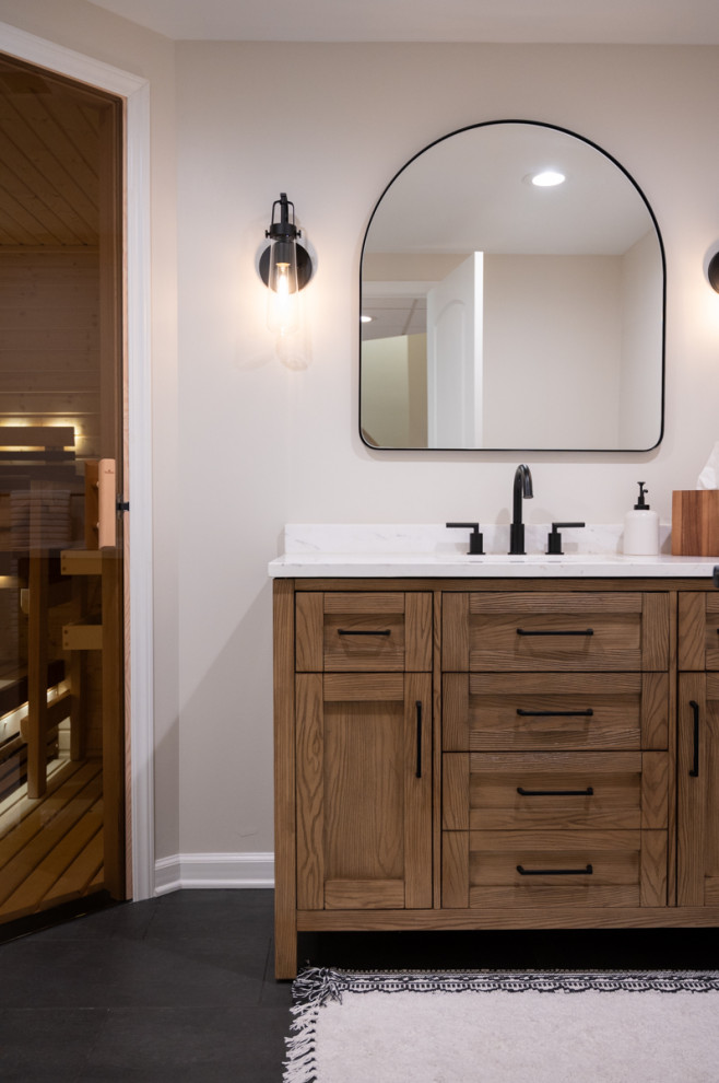 Mid-sized traditional bathroom in Detroit with an alcove shower, a two-piece toilet, ceramic floors, with a sauna, an undermount sink, quartzite benchtops, black floor, a sliding shower screen, white benchtops, a single vanity and a freestanding vanity.
