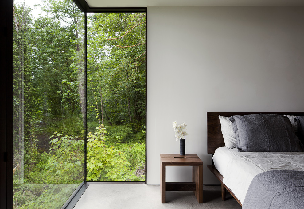 Inspiration for a modern bedroom in Seattle with white walls.