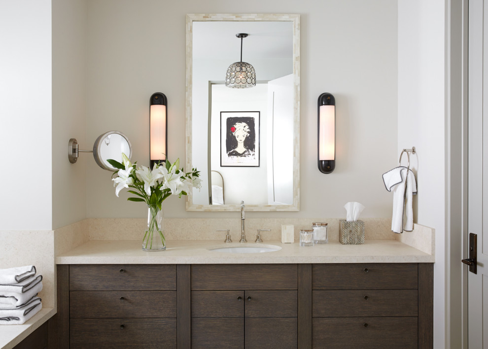 Example of a mountain style single-sink bathroom design with flat-panel cabinets, dark wood cabinets, white walls, an undermount sink, beige countertops and a built-in vanity