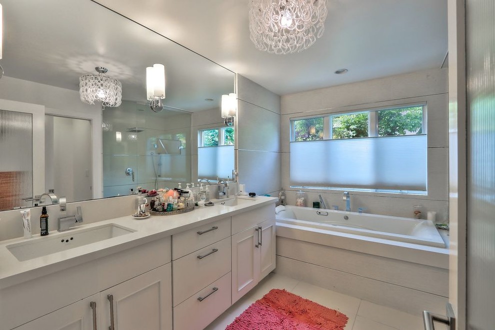 Inspiration for an expansive modern master bathroom in San Francisco with shaker cabinets, white cabinets, a drop-in tub, gray tile, grey walls, ceramic floors, an undermount sink, engineered quartz benchtops, white floor and white benchtops.