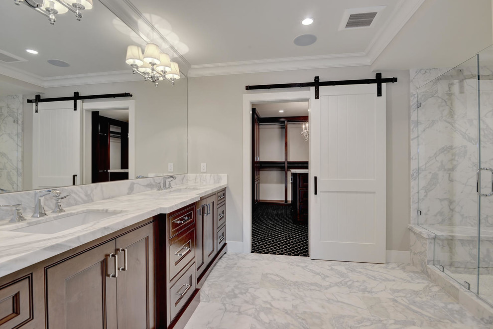 Design ideas for a large traditional master bathroom in San Francisco with brown cabinets, gray tile, marble, beige walls, marble floors, an undermount sink, marble benchtops, grey floor, a hinged shower door and beaded inset cabinets.