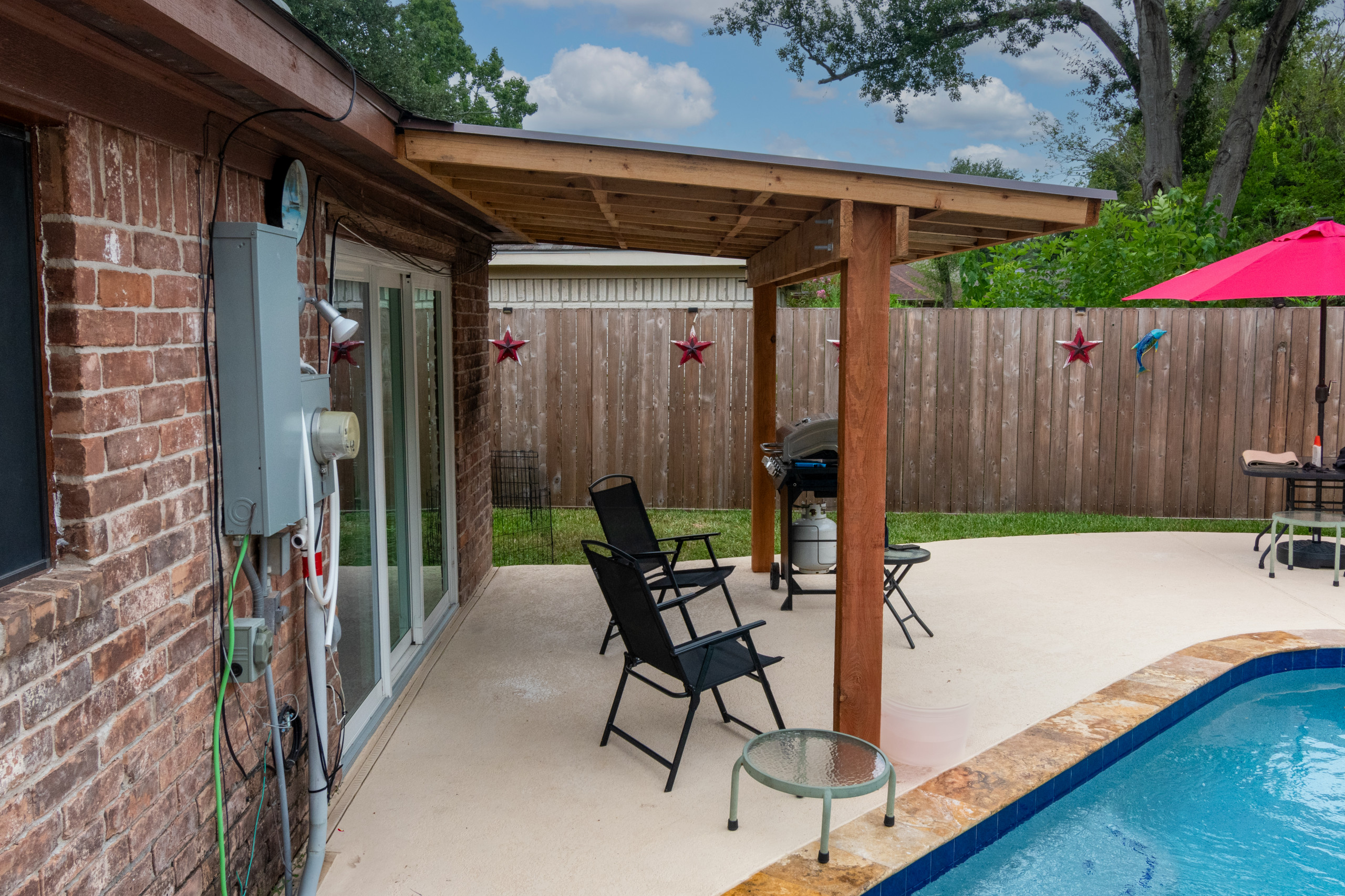 Custom Patio Cover Upgrade – Sealed Cedar & R-Panel Roofin