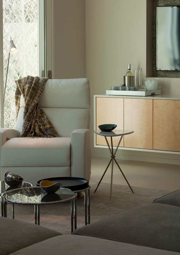 Trendy carpeted living room photo in Los Angeles with a standard fireplace and a tile fireplace