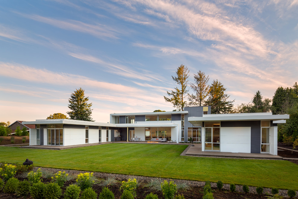 Modern one-storey multi-coloured house exterior in Portland with mixed siding and a flat roof.