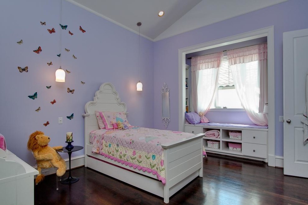 Inspiration for a traditional kids' bedroom for girls in Houston with purple walls.