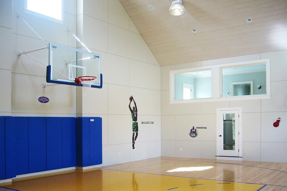 Large traditional indoor sport court in Boston with beige walls, light hardwood floors and brown floor.