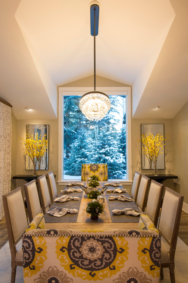 Inspiration for a mid-sized transitional medium tone wood floor and brown floor enclosed dining room remodel in Denver with yellow walls