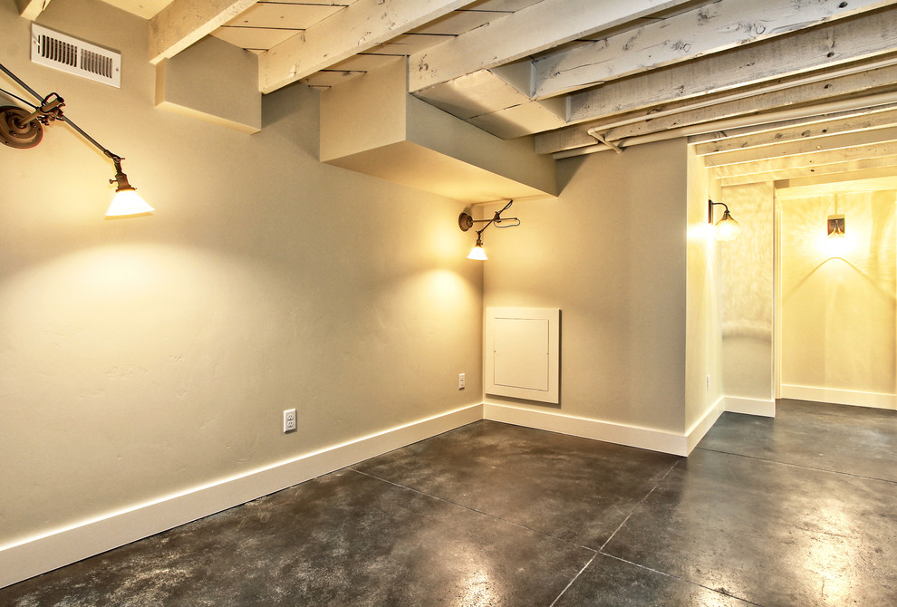 Inspiration for a small modern basement in Boise with concrete floors.