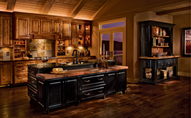 Huge mountain style single-wall medium tone wood floor eat-in kitchen photo in Denver with an undermount sink, recessed-panel cabinets, medium tone wood cabinets, granite countertops, white backsplash, ceramic backsplash, colored appliances, gray walls and an island