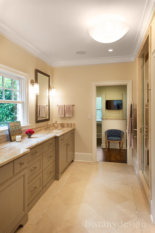 Inspiration for a mid-sized traditional master bathroom in Charlotte with an undermount sink, recessed-panel cabinets, grey cabinets, granite benchtops, beige tile, porcelain tile, beige walls and porcelain floors.
