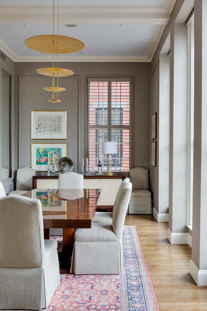 Inspiration for a mid-sized transitional separate dining room in Boston with brown walls and light hardwood floors.