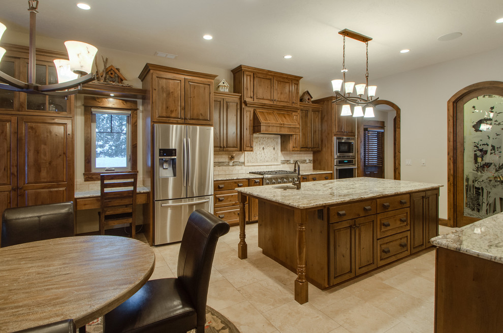 Mountain style kitchen photo with stainless steel appliances