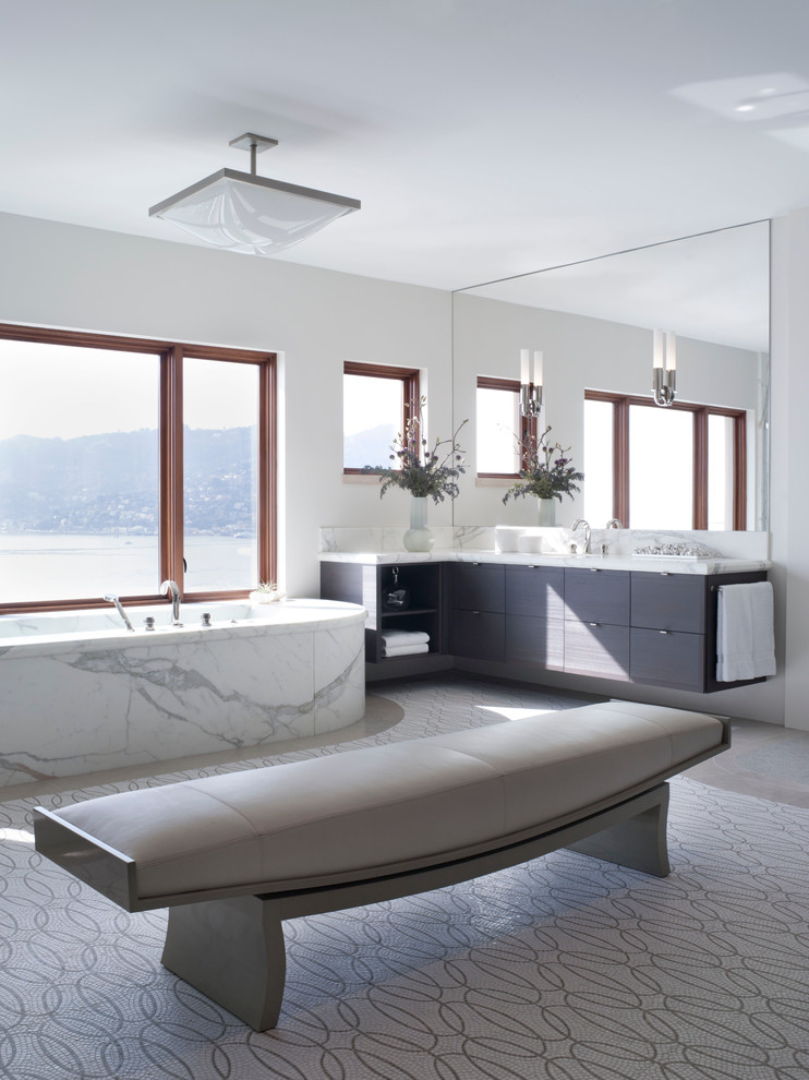 Contemporary bathroom in San Francisco with flat-panel cabinets and a freestanding tub.