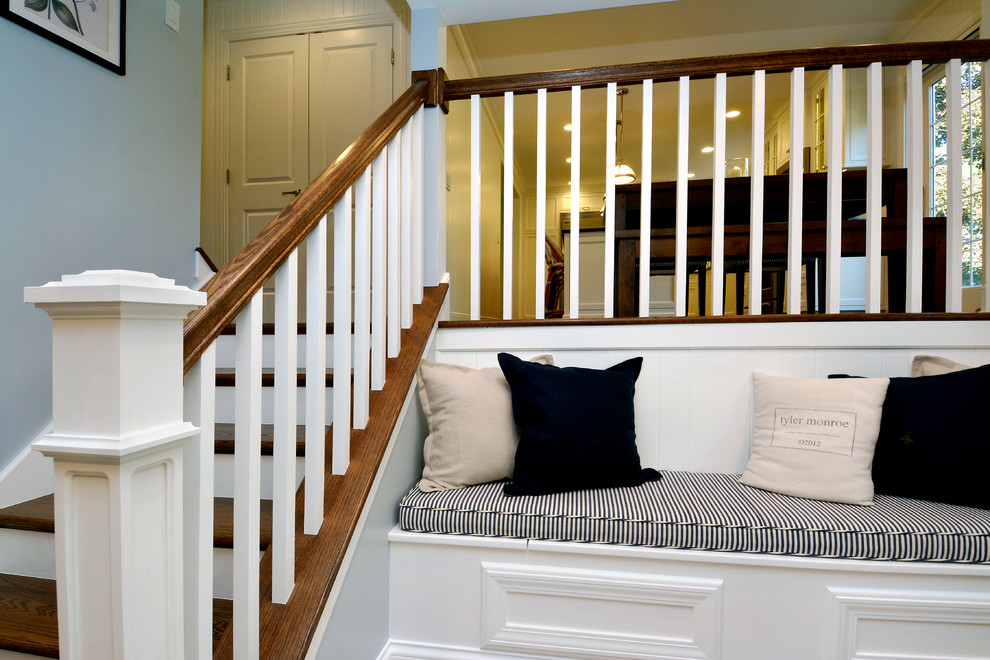 Example of a mid-sized transitional look-out carpeted and tray ceiling basement design in Chicago with white walls, a standard fireplace and a stone fireplace