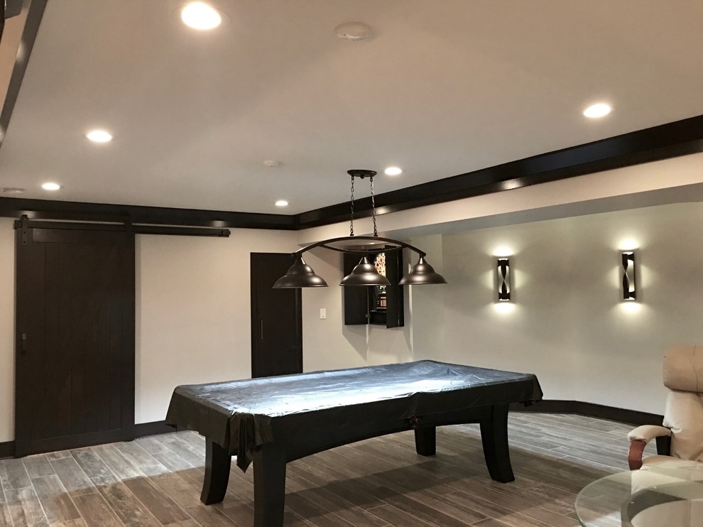 Mid-sized transitional underground dark wood floor and brown floor basement photo in Chicago with beige walls and no fireplace