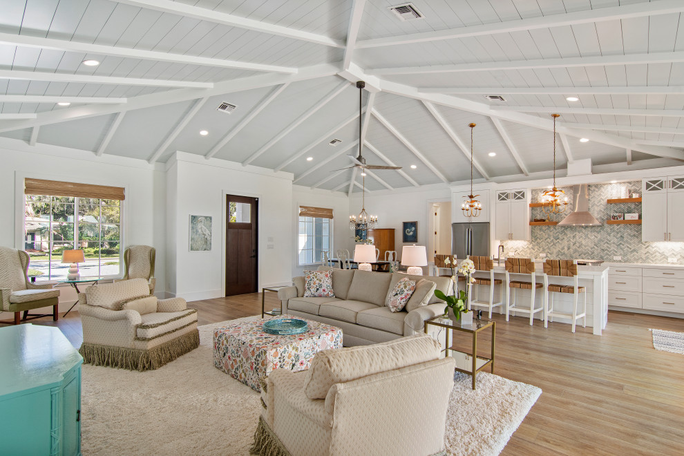 Living room - large coastal formal and open concept vinyl floor, beige floor and shiplap ceiling living room idea with white walls and a concealed tv