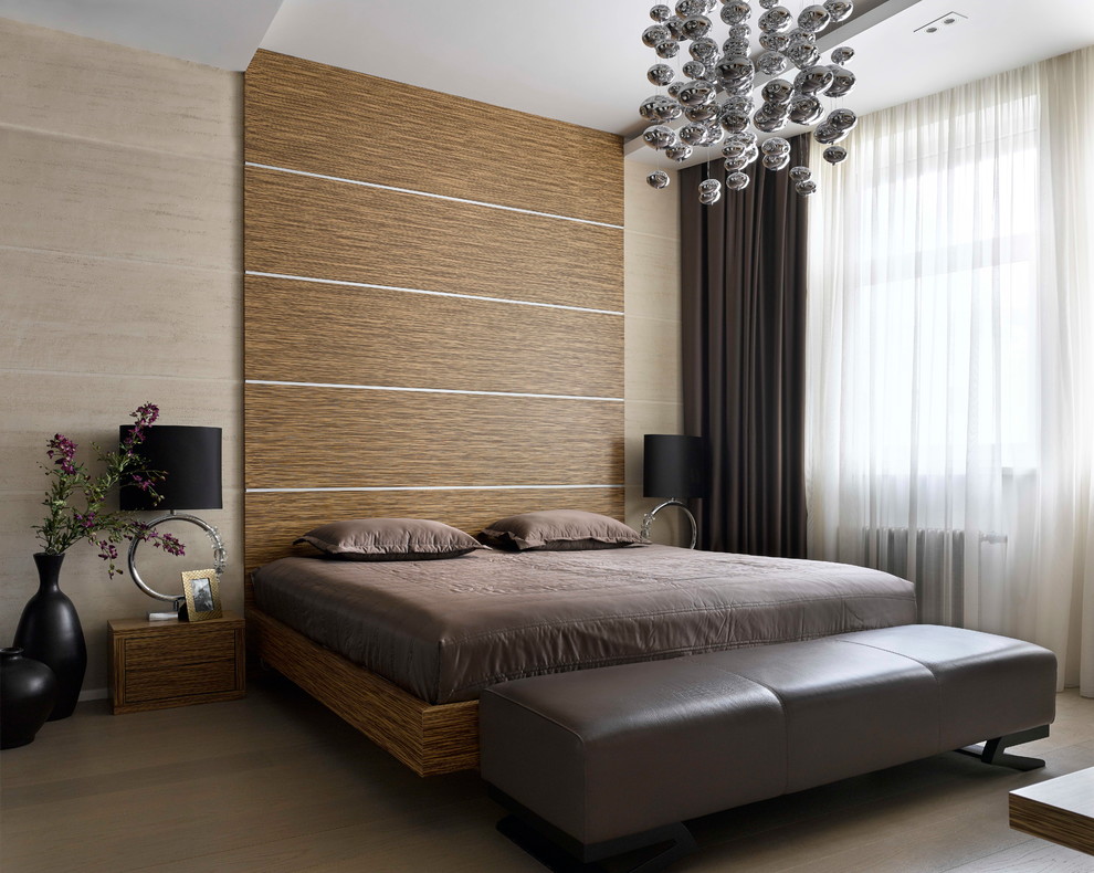Contemporary master bedroom in Moscow with brown walls, medium hardwood floors, no fireplace and brown floor.