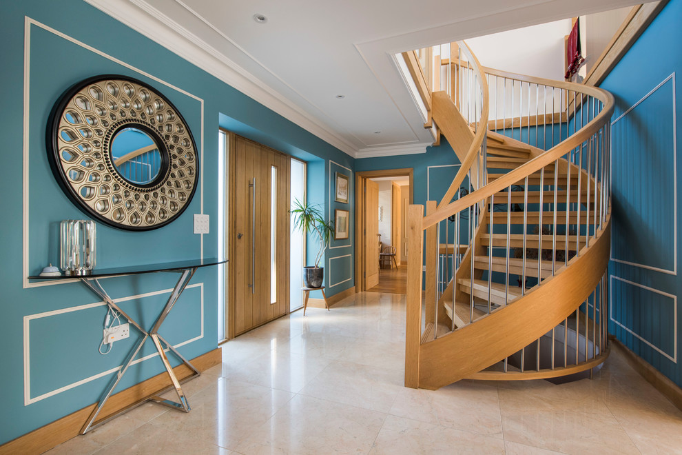 Photo of a transitional wood curved staircase in Other with wood railing.