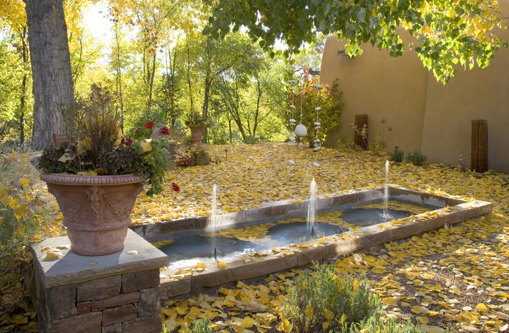 Inspiration for a mediterranean garden in Albuquerque with a water feature.