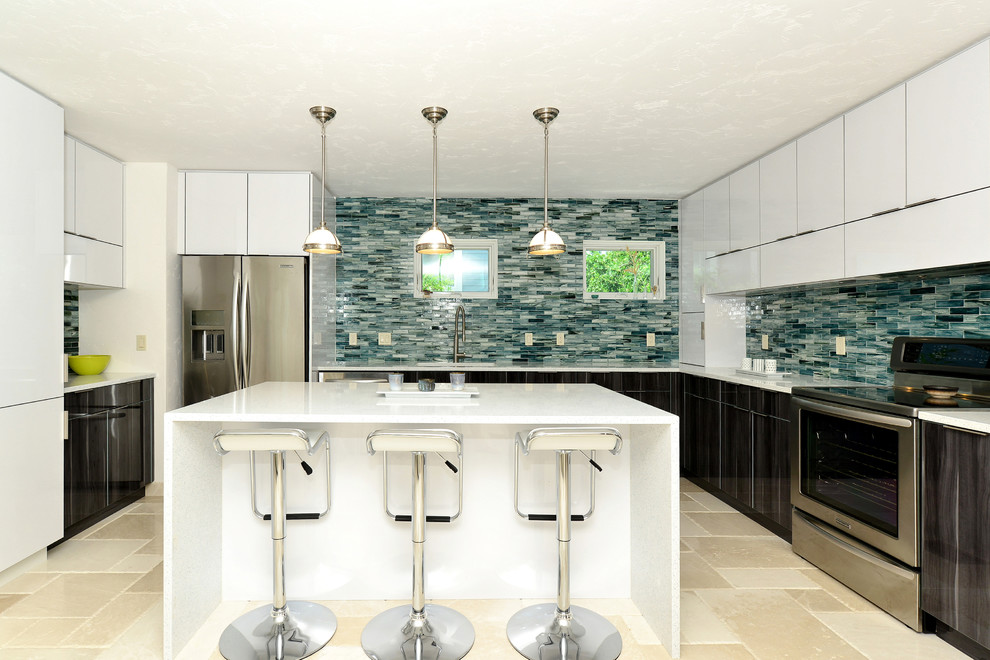 Inspiration for a mid-sized contemporary u-shaped open plan kitchen in Tampa with a drop-in sink, glass-front cabinets, dark wood cabinets, quartzite benchtops, blue splashback, glass tile splashback, stainless steel appliances, marble floors and with island.