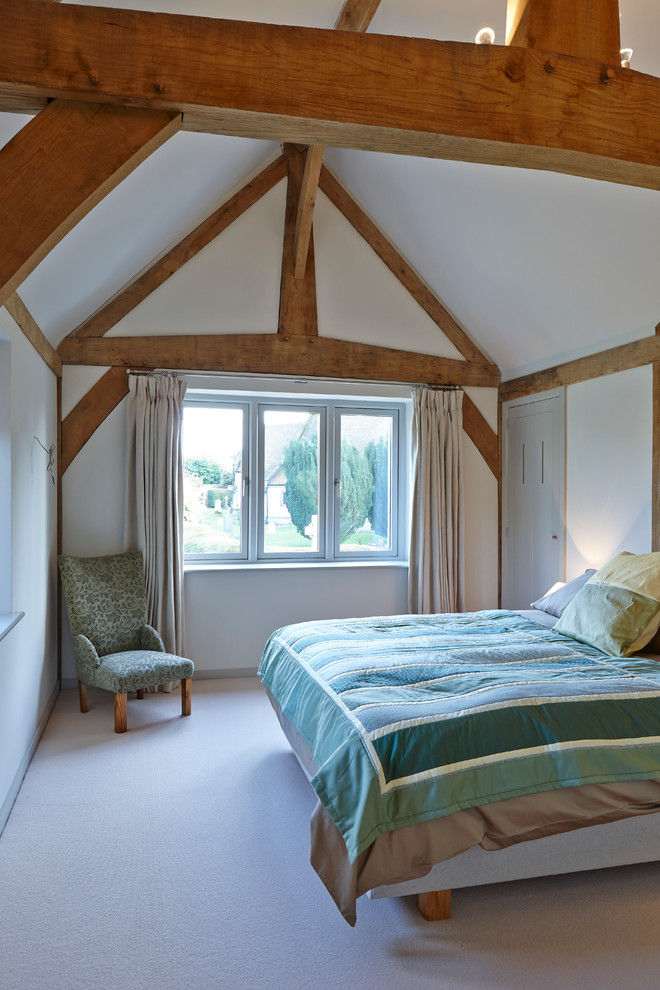 This is an example of a traditional bedroom in Hampshire.
