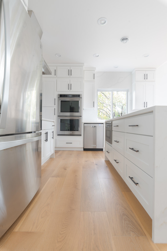 Inspiration for an expansive scandinavian kitchen in Seattle with light hardwood floors and beige floor.