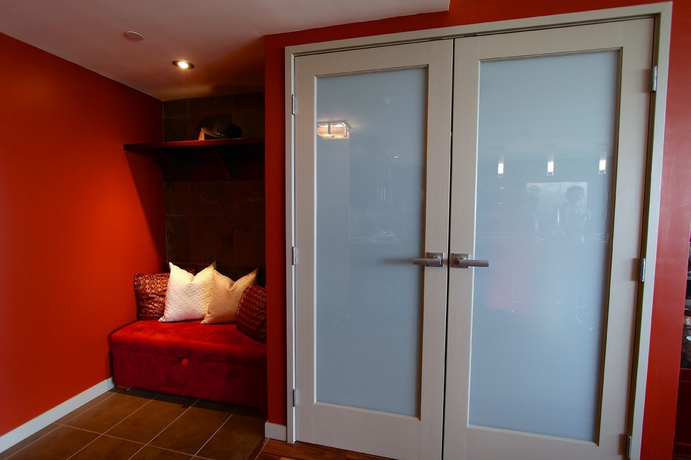 Foyer - mid-sized mediterranean porcelain tile foyer idea with red walls