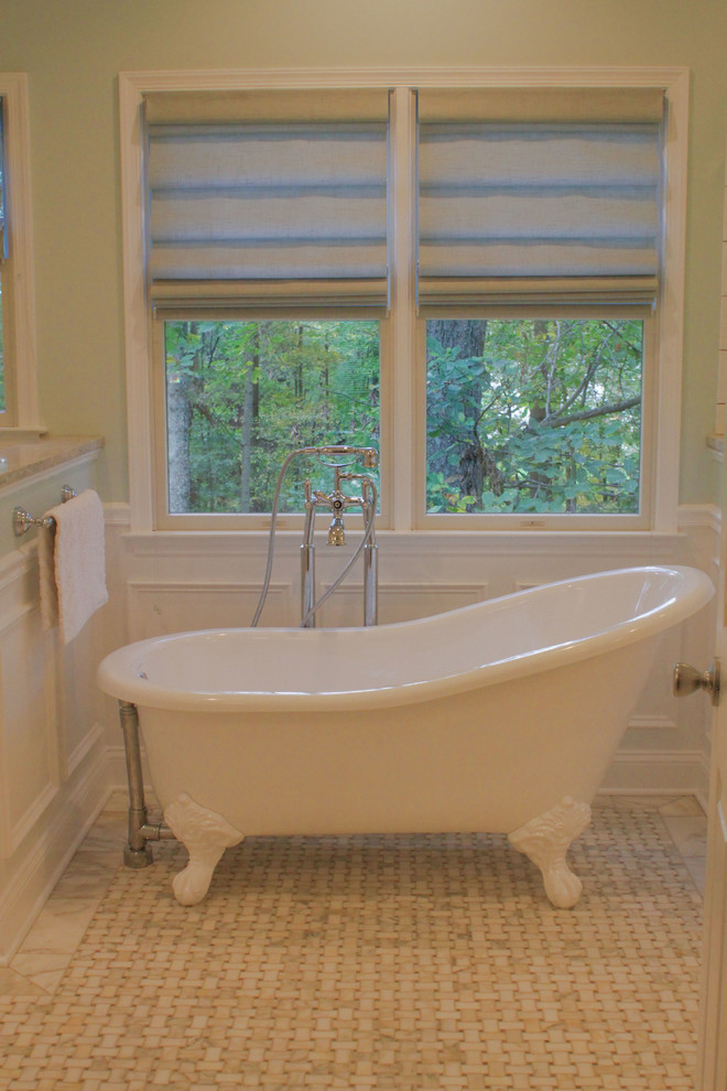 This is an example of a mid-sized traditional master bathroom in Baltimore with engineered quartz benchtops, a claw-foot tub, a corner shower, ceramic tile, blue walls and marble floors.