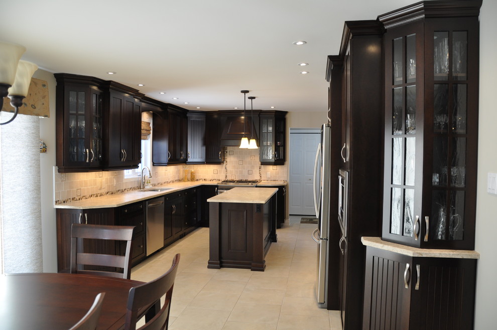 Inspiration for a large rustic single-wall ceramic tile eat-in kitchen remodel in Ottawa with an undermount sink, shaker cabinets, beige cabinets, brown backsplash, ceramic backsplash, stainless steel appliances and an island