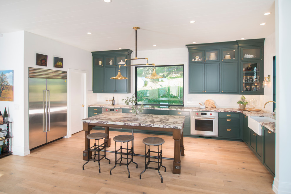 Photo of a transitional l-shaped kitchen in San Francisco with green cabinets and beaded inset cabinets.