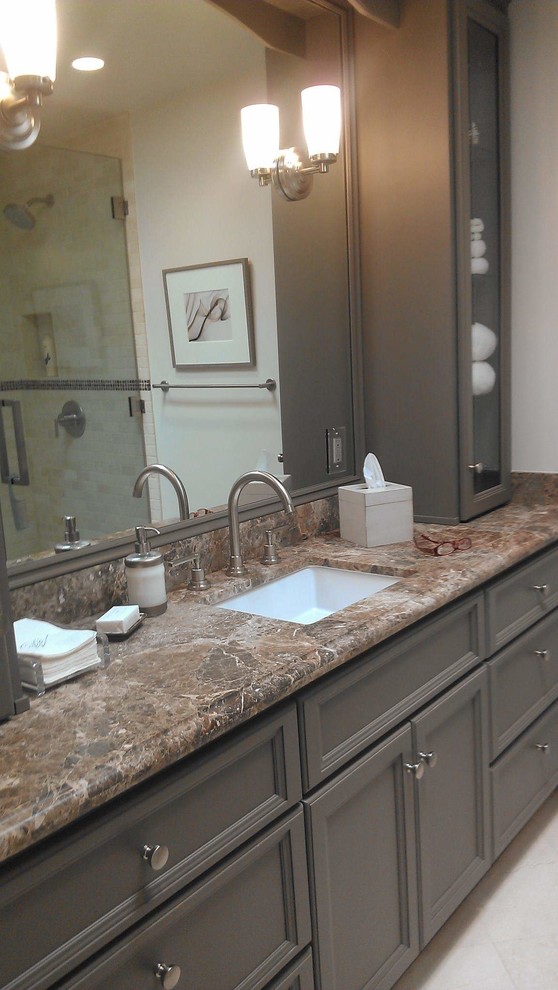 Photo of a large traditional bathroom in Baltimore with recessed-panel cabinets, grey cabinets, a freestanding tub, an alcove shower, a two-piece toilet, beige walls, travertine floors, an undermount sink, quartzite benchtops, beige floor, a hinged shower door, multi-coloured benchtops, a single vanity and a built-in vanity.