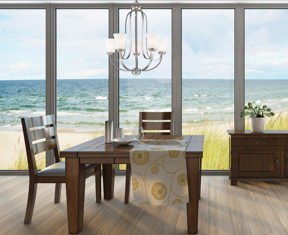Design ideas for a large beach style dining room in Vancouver with light hardwood floors.