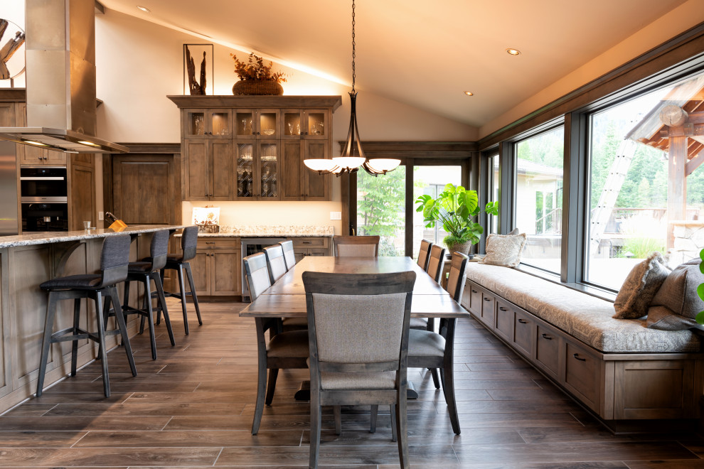 Huge transitional u-shaped ceramic tile and brown floor open concept kitchen photo in Seattle with a single-bowl sink, shaker cabinets, dark wood cabinets, quartz countertops, stainless steel appliances, two islands and multicolored countertops