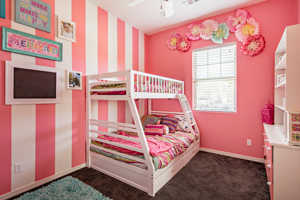 Photo of a mid-sized eclectic kids' bedroom for kids 4-10 years old and girls in Phoenix with pink walls and carpet.